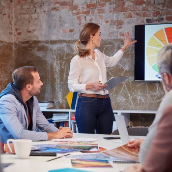 1080-_0001_businesswoman-holding-presentation-at-a-meeting-wi-2026-01-05-00-41-13-utc